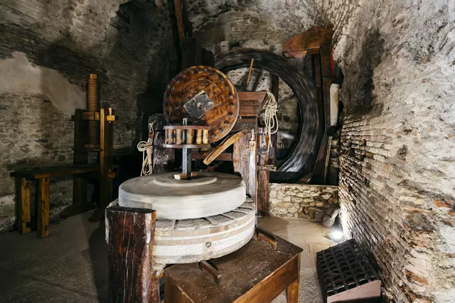 Grinding stones in a water mill for grinding grain